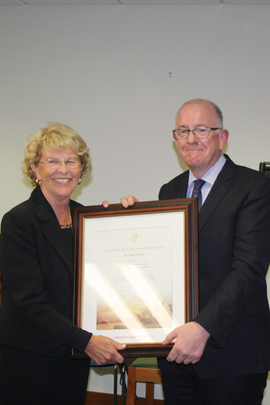 Minister Flanagan presents Dr. Molly Sheedy with a Certificate of Irish Heritage in recognition of her long service to the cause of reconciliation on the island of Ireland.
