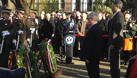 Tánaiste and US Chargé d’Affaires Stuart Dwyer laying wreaths at the US Embassy on the 50th Anniversary of the death of President Kennedy
