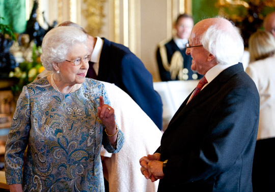 Pictured is President of Ireland Michael D Higgins with Her Majesty Queen Elizabeth II viewing a display of Irish Items from the Royal Collection in the Green Drawing Room in Windsor Castle on the first official day of the Presidents 5 day State Visit to the United Kingdom. Photo Chris Bellew / Copyright Fennell Photography