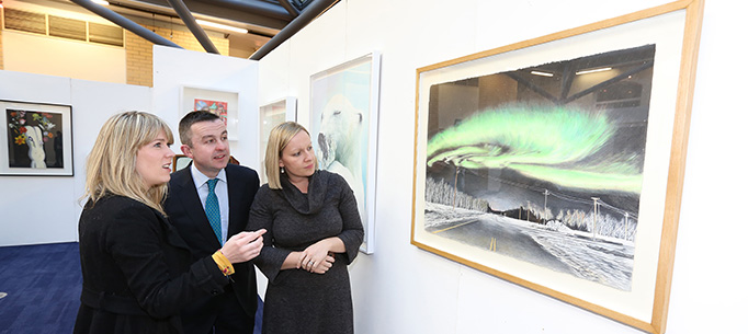 Minister Hayes and Minister Creighton viewing some of the art work. 