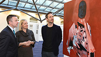 Minister Hayes and Minister Creighton viewing some of the art work.