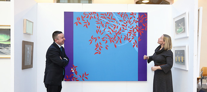 Minister Hayes and Minister Creighton viewing some of the art work. 