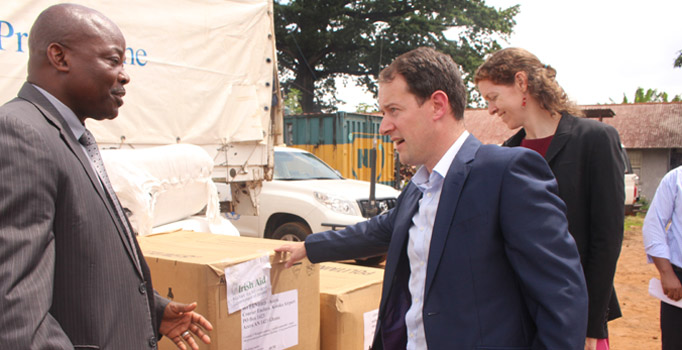 Minister Sherlock with Mr Gon Myers of the World Food Programme and Ambassador Sinead Walsh overseeing Irish Aid support to Sierra Leone, 2 October 2014