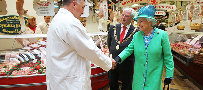 Her Majesty Queen Elizabeth II  meeting trader Jerry Moynihan on a tour of  The Old English Market, Cork City, on her on Friday on her State Visit to Ireland.