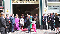 Her Majesty Queen Elizabeth II is presented with a posy of flowers with Julie Ann Higgins, a daughter of trader with Lord Mayor of Cork Cllr. Michael O'Connell leaving The Old English Market, Cork City, on her on Friday on her State Visit to Ireland.
