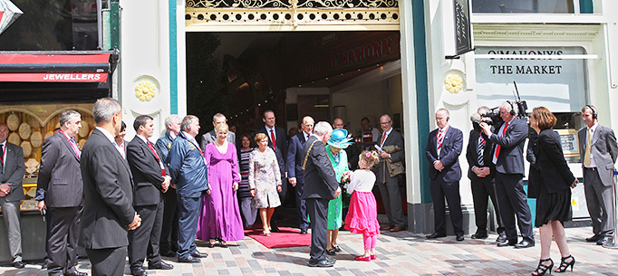 Her Majesty Queen Elizabeth II is presented with a posy of flowers with Julie Ann Higgins, a daughter of trader with Lord Mayor of Cork Cllr. Michael O'Connell leaving The Old English Market, Cork City, on her on Friday on her State Visit to Ireland.
