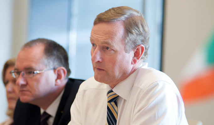 An Taoiseach Enda Kenny, Prime Minister of Ireland, speaks with John Hinshaw Executive Vice President of Technology & Operations for Hewlett Packard at the company's headquarters office in Palo Alto, California on June 05, 2014