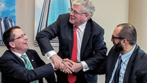 The T&aacute;naiste is pictured here with Martin McVicar, Managing Director of Combilift and Kenan Araci, General Manager of Cuhadaroğlu.