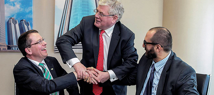 The T&aacute;naiste is pictured here with Martin McVicar, Managing Director of Combilift and Kenan Araci, General Manager of Cuhadaroğlu.