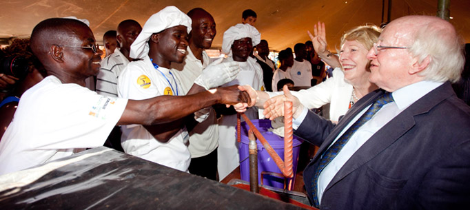 President Michael D Higgins and his wife Sabina with some Honey Farmers who are part of a community base enterprise during their visit to Saopampeni Village in the Salima District, Malawi. Photo Chris Bellew / Fennell Photography 2014