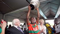 Pictured is President Michael D Higgins and his wife Sabina at the SA Gaels blitz, at the University of Pretoria in South Africa, where the SA Gaels train , presenting the Presidents Cup to the captain of the 'Mayo' team, Steven Malinga on the fourteenth day of the Presidents 22 day official visit to Ethiopia, Malawi and South Africa.Photo Chris Bellew / Copyright Fennell Photography 2014