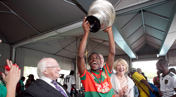 Pictured is President Michael D Higgins and his wife Sabina at the SA Gaels blitz, at the University of Pretoria in South Africa, where the SA Gaels train , presenting the Presidents Cup to the captain of the 'Mayo' team, Steven Malinga on the fourteenth day of the Presidents 22 day official visit to Ethiopia, Malawi and South Africa.Photo Chris Bellew / Copyright Fennell Photography 2014