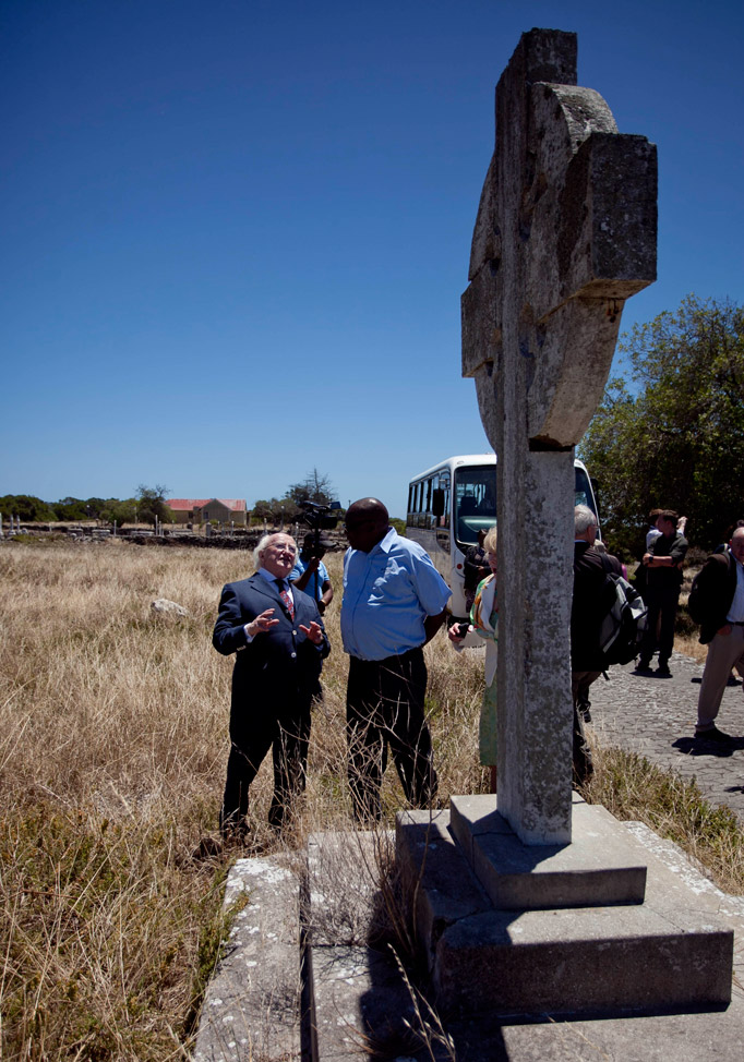 Pictured is President Michael D Higgins with Thulani Mabaso , a political prisioner at Robben Island from 86-91, viewing the Irish Cross erected in the Irish Village to comemorate the Irish who worked in the Leper Colony on Robben Island, Cape Town, on the nineteenth day of the Presidents 22 day official visit to Ethiopia, Malawi and South Africa.Photo Chris Bellew / Fennell Photography 2014