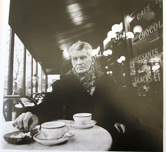 Samuel Beckett photographed in his favourite Café, Boulevard St. Jacques, Paris, 1985 © copyright of John Minihan 