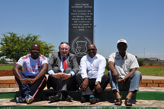 Tony McCullagh, Deputy head of Mission, Freddy Motshophi, Embassy Driver, School Principal Mr Masenya and Coach Mr Digashu at the School Memorial.