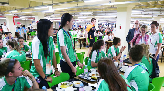 Ambassador O'Donoghue joins the Irish athletes for lunch in the Athletes’ Village in Gwangju.
