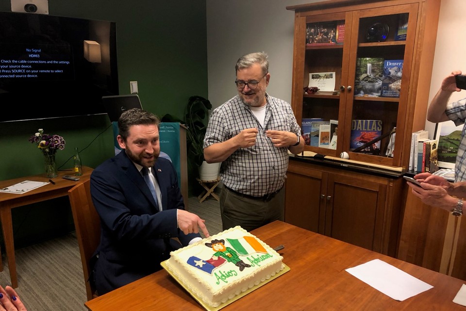 'Adiós Adrian' - Brian McNerney from the Finnegans Wake Reading Group presenting Consul General Adrian Farrell with a special Texas farewell cake. 