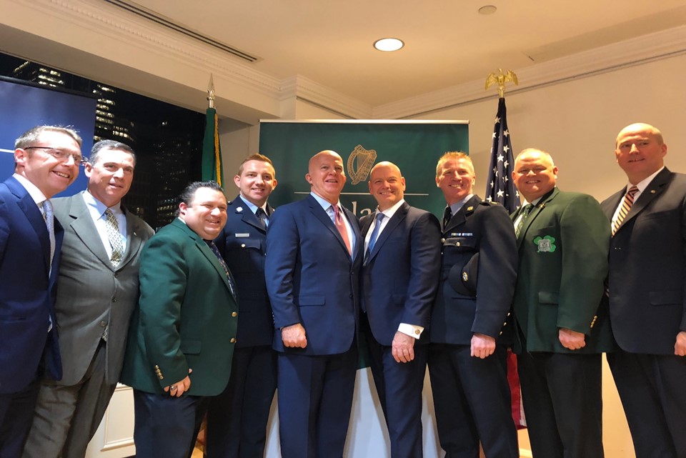 Consul General Ciarán Madden, New York City Police Commissioner James O'Neill, and members of the Gardaí and NYPD at the Consulate General of Ireland, New York celebrating the launch of Mark Condren's NYPD: Behind the Scenes. ©DFAT. 