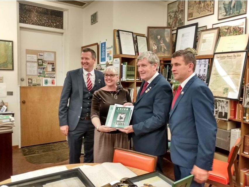 Consul General Robert O'Driscoll, UICC Librarian Jennifer Drennan, Ambassador Daniel Mulhall and UICC Board President Liam Reidy at the P.J. Dowling Library in San Francisco. 