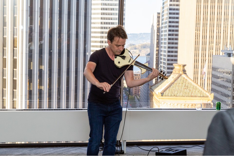 Composer & violinist Colm O Riain performing at Ireland House Reception