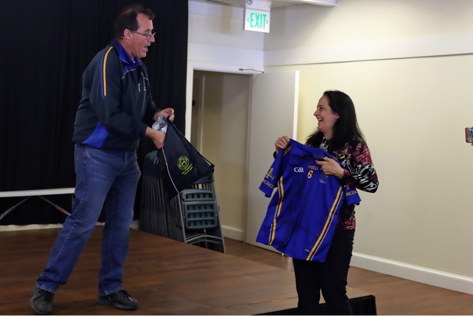 Bertie Penny presents Minister Martin with SFYGAA jerseys for her children