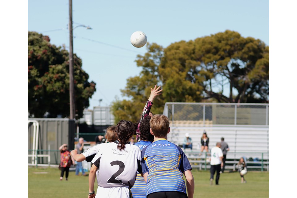 Minister Martin tosses up football in exhibition match