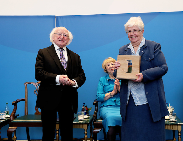 Sr. Pat Murray ibvm receives the Presidential Distinguished Service Award from President Higgins