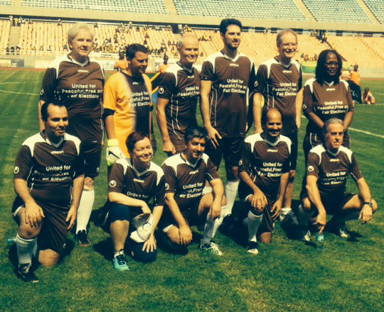 Ambassador Gilsenan plays soccer for peaceful elections