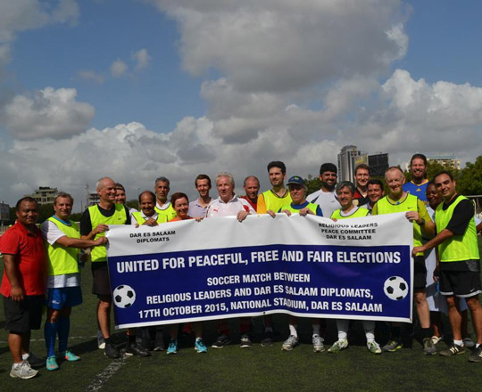Ambassador Gilsenan plays soccer for peaceful elections