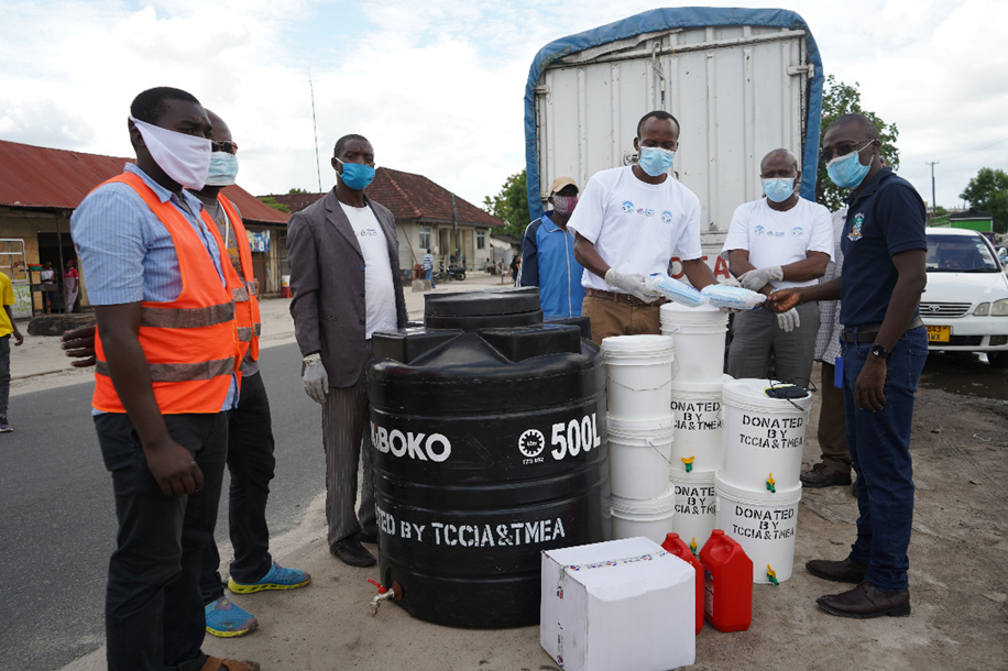 Beneficiaries receiving a delivery of PPE equipment and handwashing facilities by TMEA