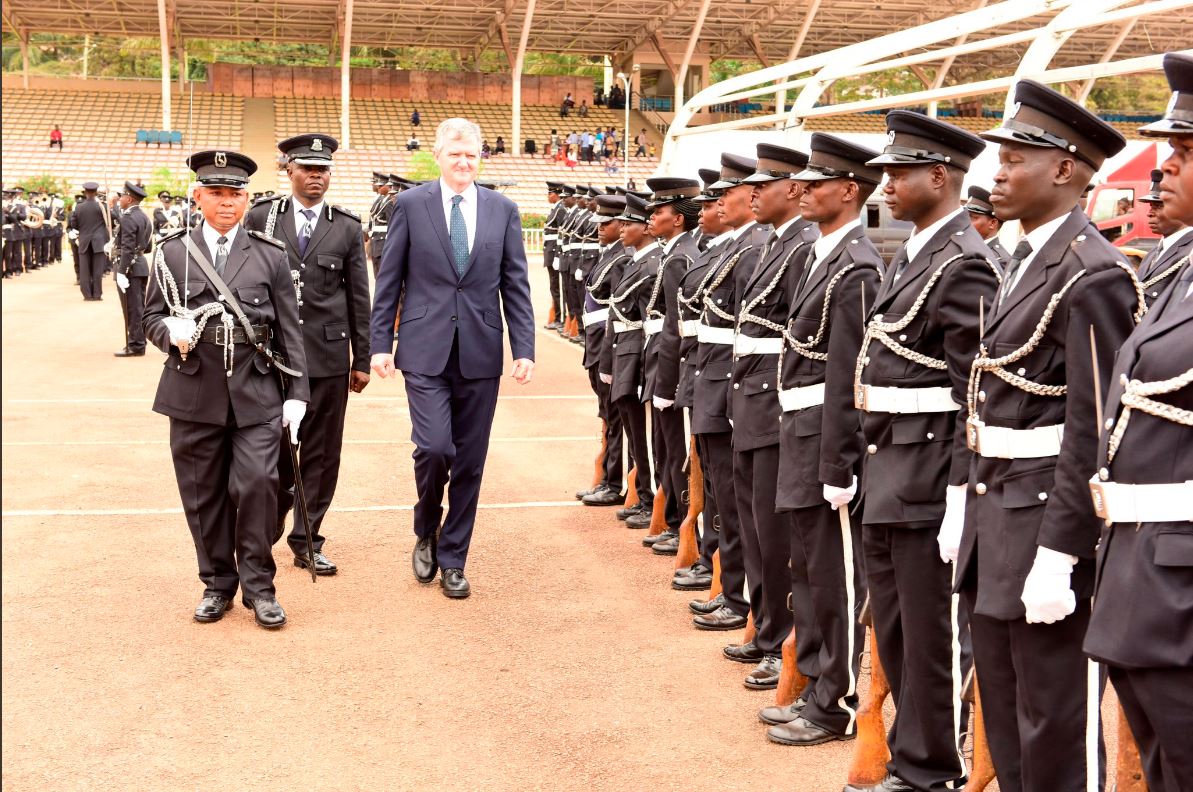 Ambassador William Carlos inspecting a guard of honour at Kololo Airstrip