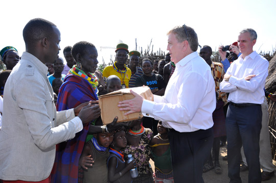 Deputy Pat Breen giving a hamper to Social Protection Beneficiary in Karamoja