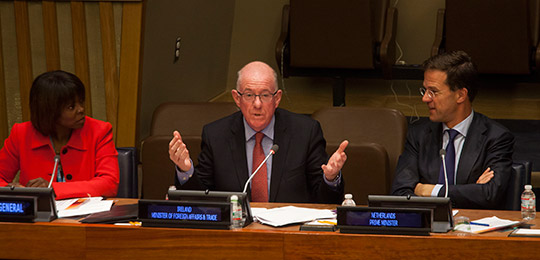 Charles Flanagan, Minister for Foreign Affairs and Trade, Ireland, speaks at the Delivering Zero Hunger – Demonstrating Impact High Level Side Event, as Ertharin Cousin, left, Executive Director of the United Nations World Food Programme, and Mark Rutte, right, Prime Minister of the Netherlands, look on, at the United Nations in New York, U.S., on Thursday, September 25, 2014. (c) Michael Nagle